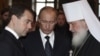 Will Russian President Vladimir Putin (center) use high-profile meetings abroad by Prime Minister Dmitry Medvedev (left) and Orthodox Patriarch Kirill (right) to build real bridges, or to execute tactical moves in a mounting confrontation with the West?
