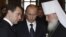 Will Russian President Vladimir Putin (center) use high-profile meetings abroad by Prime Minister Dmitry Medvedev (left) and Orthodox Patriarch Kirill (right) to build real bridges, or to execute tactical moves in a mounting confrontation with the West?