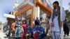 Afghan people displaced from Kunduz demand food and shelter at a government protest in Kabul on October 7.