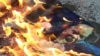 Портрет президента США Дональда Трампа, который сожгли в Симферополе, 16 апреля 2018 года