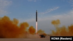 The launch of a Hwasong-12 missile in an undated photo released by North Korea's Korean Central News Agency on September 16