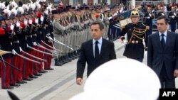 French President Nicolas Sarkozy (center) and Prime Minister Francois Fillon (right) take part in a ceremony marking the 65th anniversary of the Allied victory over Nazi Germany in World War II in Colmar, in eastern France.
