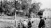 East German border police set up barbed wire along the border between East and West Germany.