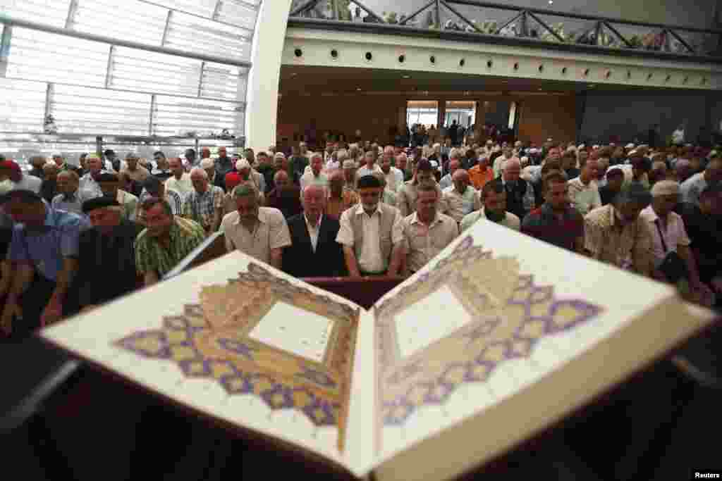 Worshippers pray in the newly opened mosque. 