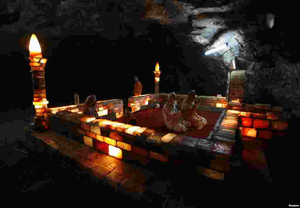 Miners and visitors pray at a mosque made from rock salt inside Khewra mines