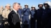 Russian President Vladimir Putin meets with servicemen as he visits Hmeimim air base on December 11, when he declared victory over Islamic State militants.