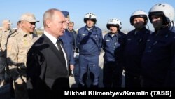 Russian President Vladimir Putin meets with servicemen as he visits Hmeimim air base on December 11, when he declared victory over Islamic State militants.