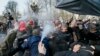 Ukrainian nationalists clash with pro-Russia supporters who were trying to lay flowers at the monument to Nikolai Vatutin in downtown Kyiv. The pro-Russia supporters had gathered to mark the 74th anniversary of death of the former Soviet general of WWII.