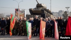 People commemorate the soldiers from Transdniester killed in its war against Moldova, in Tiraspol on March 3. The prosecutor-general of the breakaway region said the attack was to take place in a crowded area of the region's capital.