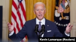 U.S. President Joe Biden delivers remarks from the White House as he takes part in the online Munich Security Conference.