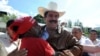 Supporters greet ousted Honduran President Manuel Zelaya as he arrives at the Brazilian Embassy in Tegucigalpa on September 21.