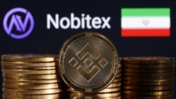 Iran - Representations of cryptocurrency Binance are seen in front of displayed Nobitex logo and Iran flag in this illustration taken November 3, 2022. 