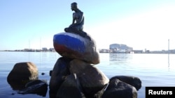 The 110-year-old bronze statue depicts the little mermaid from 19th-century Danish author Hans Christian Andersen's tale of the same name, and sits on a rock by a waterside promenade.