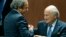 Switzerland -- UEFA President Michel Platini (L) congratulates FIFA President Sepp Blatter after he was re-elected at the 65th FIFA Congress in Zurich, Switzerland, May 29, 2015. 