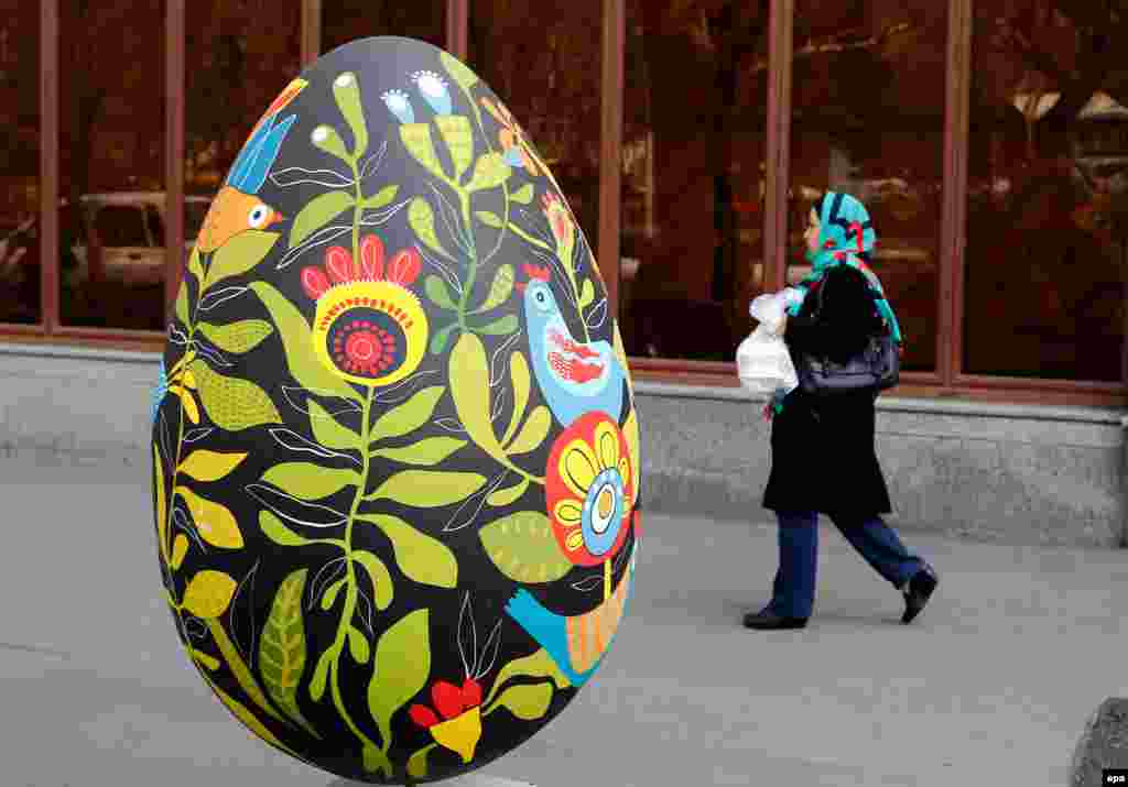 An Iranian woman walks past a large decorated egg, a symbol of Nowruz, the Persian New Year, in Tehran. The Persian New Year, starting on March 20, also marks the beginning of spring. The holiday has been celebrated for at least 3,000 years and is the most revered in the greater Persian world, which includes the countries of Iran, Afghanistan, Azerbaijan, Turkey, portions of western China, and northern Iraq. (epa/Abedin Taherkenareh)