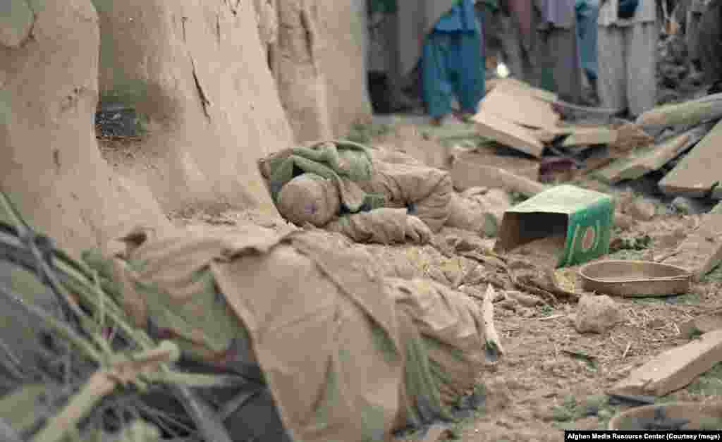 The body of an Afghan man killed in a Soviet bombardment. At least 500,000 Afghan civilians were killed and 5 million more -- or one-third of the population -- displaced.