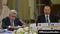 Russia - Azerbaijani President Ilham Aliyev (R) looks on as his Armenian counterpart Serzh Sarkisian speaks at a Commonwealth of Independent States summit in Sochi, 11Oct2017.