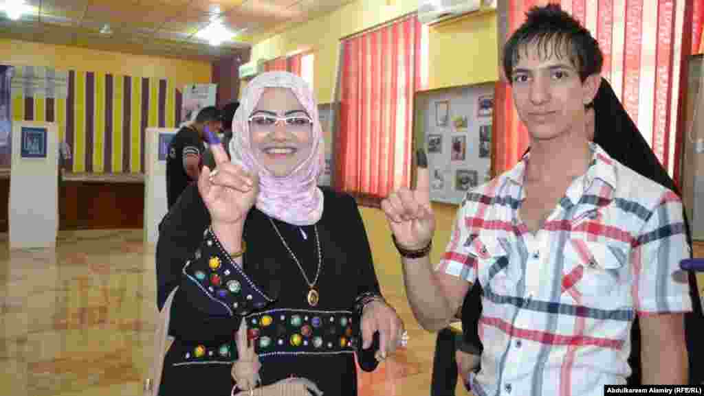 Voters after casting their ballots in Basra.