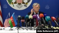 U.S. national-security adviser John Bolton speaks to the media after his talks with Azerbaijani President Ilham Aliyev in Baku on October 24.