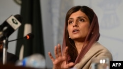 Pakistani Foreign Minister Hina Rabbani gestures as she addresses a press conference on the first day of the D-8 summit in Islamabad on November 19.