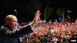 Turkish President Recep Tayyip Erdogan waving during a rally in Istanbul, Turkey on July 18 . 