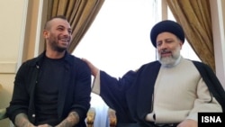 Iranian rapper Amir Tataloo meets then-presidential election candidate Ebrahim Raisi in 2017. 