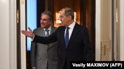 Russian Foreign Minister Sergei Lavrov (right) welcomes Pakistani Foreign Minister Shah Mehmood Qureshi during his visit to Moscow on December 26. 