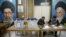 Poll workers are seen during parliamentary elections at a polling station in Tehran, February 21, 2020