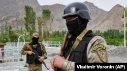 Kyrgyz soldiers guard a water supply facility outside the village of Kok-Tash near the Kyrgyz-Tajik border.