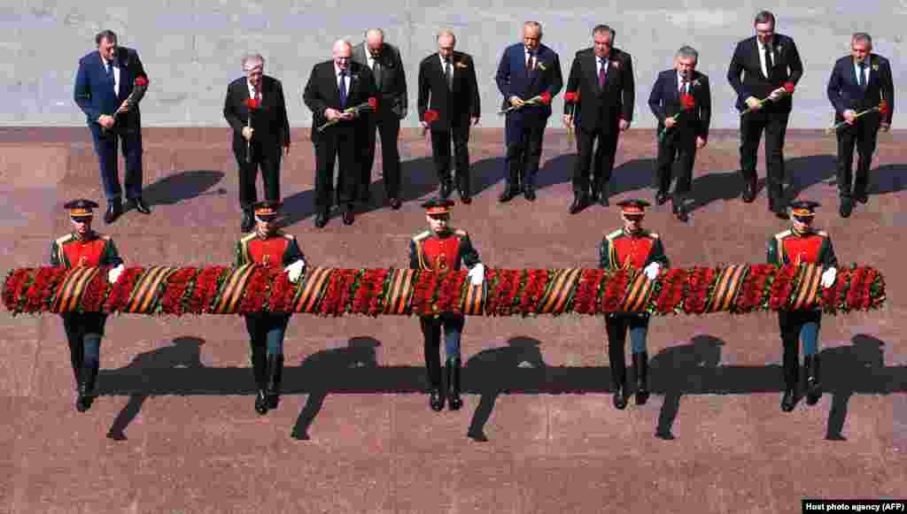 Russian President Vladimir Putin (fifth from left) and other heads of state attend a flower-laying ceremony at the Tomb of the Unknown Soldier by the Kremlin Wall in downtown Moscow on June 24. (AFP/Alexey Filippov)