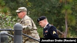 U.S. Army Sergeant Bowe Bergdahl, right, arrives at the court house for a hearing in the case of United States vs. Bergdahl in Fort Bragg, North Carolina, on October 16.