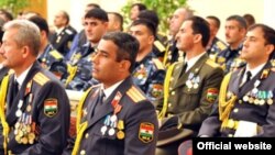 A group of Tajik officers attend a ceremony to receive promotions from President Emomali Rahmon.