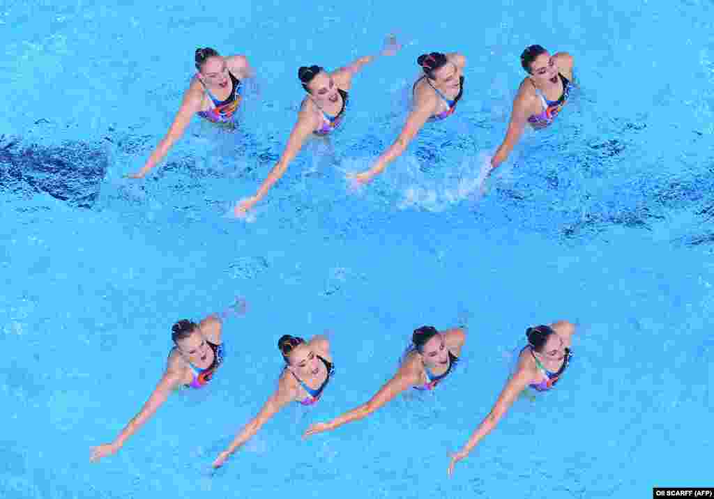 An overview shows Team Russia competes in the team free routine artistic swimming event during the Tokyo 2020 Olympic Games at the Tokyo Aquatics Centre in Tokyo on August 7, 2021.&nbsp; Russian artistic swimmer Svetlana Romashina won her seventh career Olympic gold medal on August 7 as part of Russia&rsquo;s winning team. It was the sixth consecutive gold medal for Russia in the team event. China took the silver, while Ukraine got the bronze. Romashina, 31, became the most successful Olympic artistic swimmer ever when she won gold in the duet competition on August 4. It was her third consecutive gold in that event.