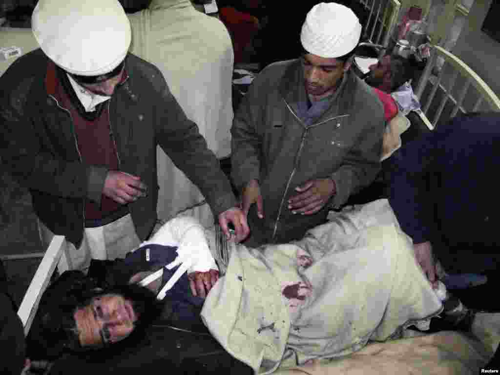 A wounded man receives treatment in Mingora.