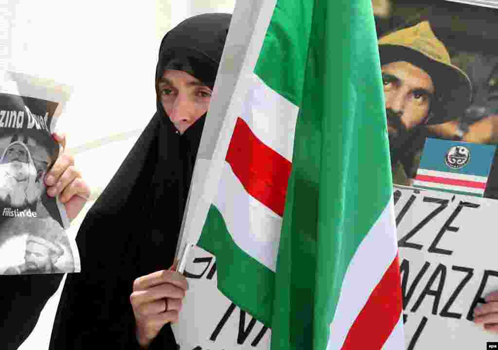 Mourners carry Chechen flags at a memorial event for Chechen warlord Shamil Basayev in Turkey (epa) - Russia has long claimed the war in Chechnya is over and that the security challenge now is to enforce law. The death in July of Shamil Basayev, the most prominent and controversial Chechen warlord, seemed to presage the end of the conflict. But in October a senior Russian general said the number of attacks by militants was on the rise. Violence, it seems, remains commonplace -- as do human rights abuses.