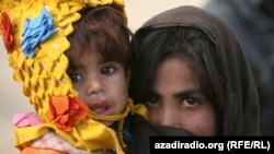 Two children at a UN camp. Photo by RFE/RL's Radio Free Afghanistan - NATO's leading civilian representative, Mark Sedwill, caused an uproar recently when he said children are safer in Kabul than they are the Scottish city of Glasgow. Click here to view photos of children living in the Afghan capital and see if you agree.