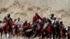 Afghan horsemen compete during a buzkashi game in Panjshir Province, north of Kabul. (Reuters/Omar Sobhani)