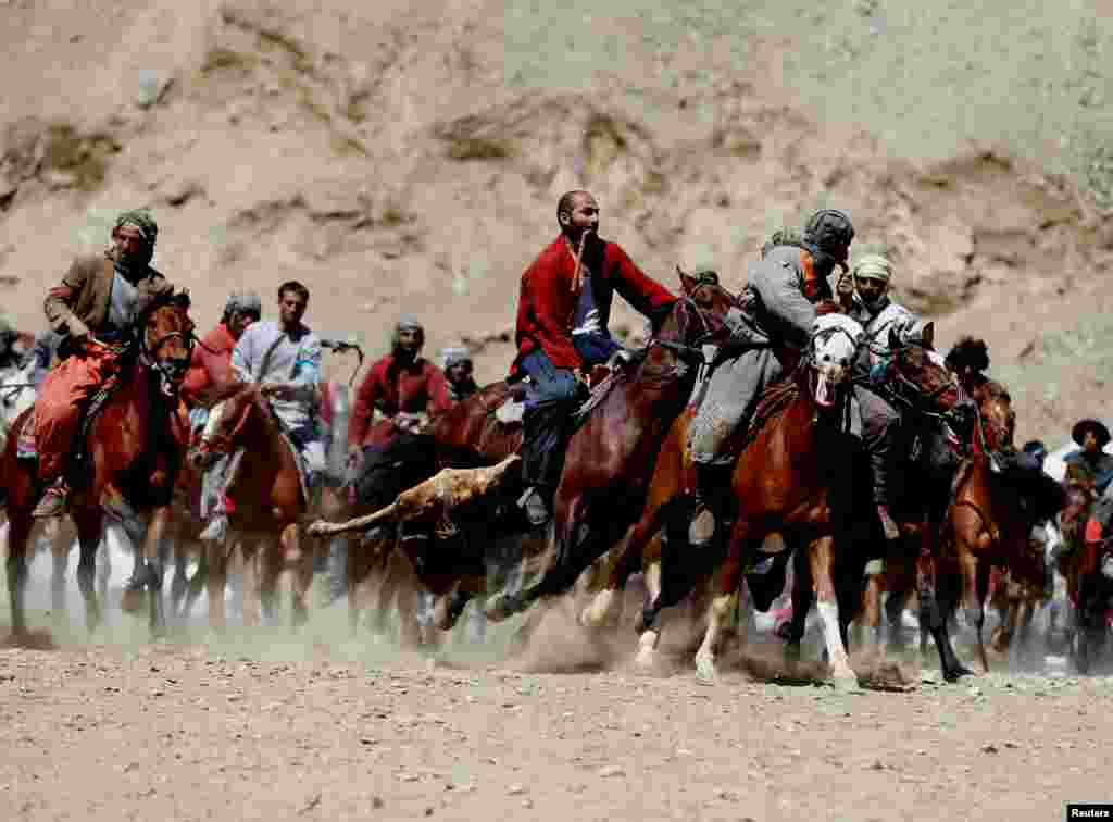 Afghan horsemen compete during a buzkashi game in Panjshir Province, north of Kabul. (Reuters/Omar Sobhani)