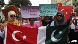 Pakistani students of the private PakTurk International Schools and Colleges hold placards during a protest in Karachi on November 18, 2016.