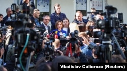 Moldovan President Maia Sandu speaks at a polling station in Chisinau on September 28.