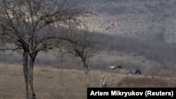 An Azerbaijani soldier takes a position in Nagorno-Karabakh.