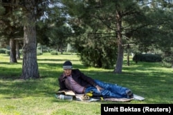 A man reading his book in a park in Ashgabat on March 20.