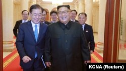Түштүк жана Түндүк Корея президенттери. 