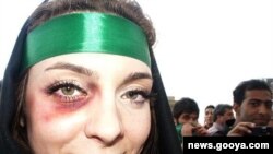 A woman at an opposition rally in Tehran