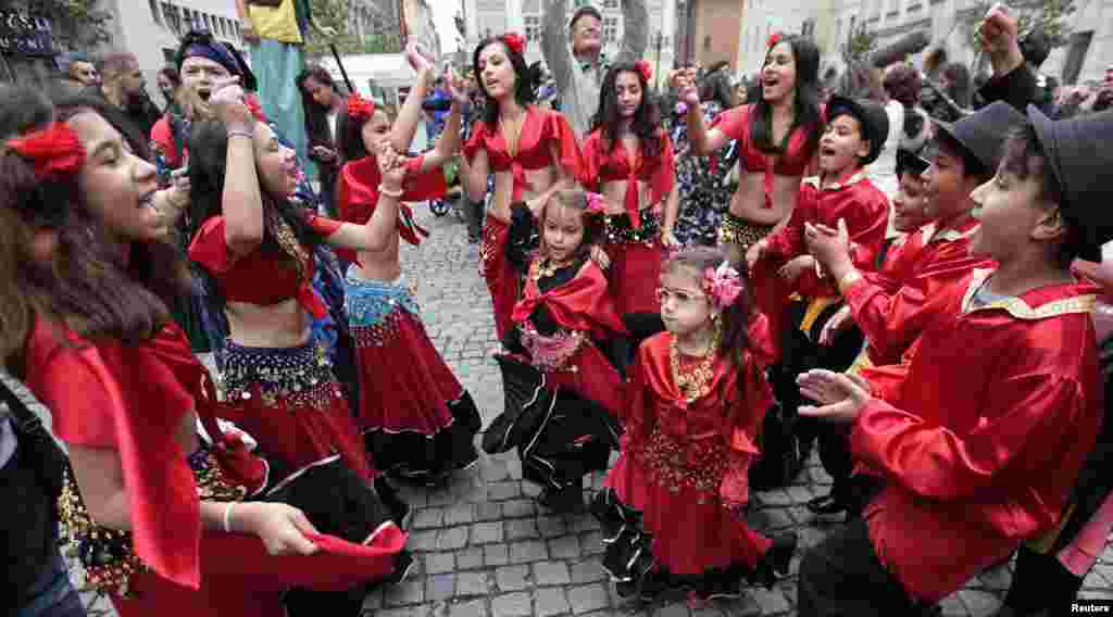 Participants of the Khamoro World Roma Festival dance through the historical center of Prague. (Reuters/David Cerny)