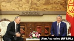 While one commenter noted that Kyrgyz President Almazbek Atambaev (right) may want to place loyalists in power after his term ends, it's not like Russia's Putin and Medvedev changing places.