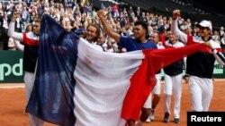 France celebrates after defeating Serbia to advance to the Davis Cup finals against Belgium.