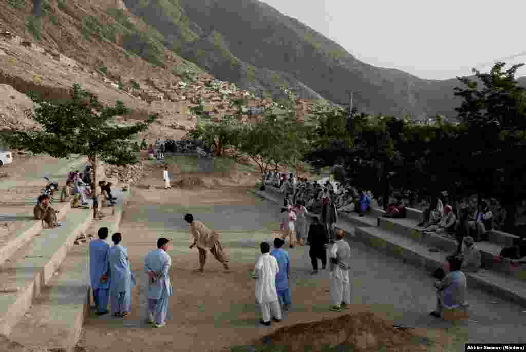 Hazara men play a round of Sang Girag in a Hazara enclave within Quetta.