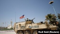 A U.S military vehicle travels in the town of Amuda, Syria April 29, 2017. 