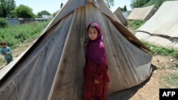 FILE: Hundreds of thousands of vulnerable Pakistanis depend on aid groups for essential services.